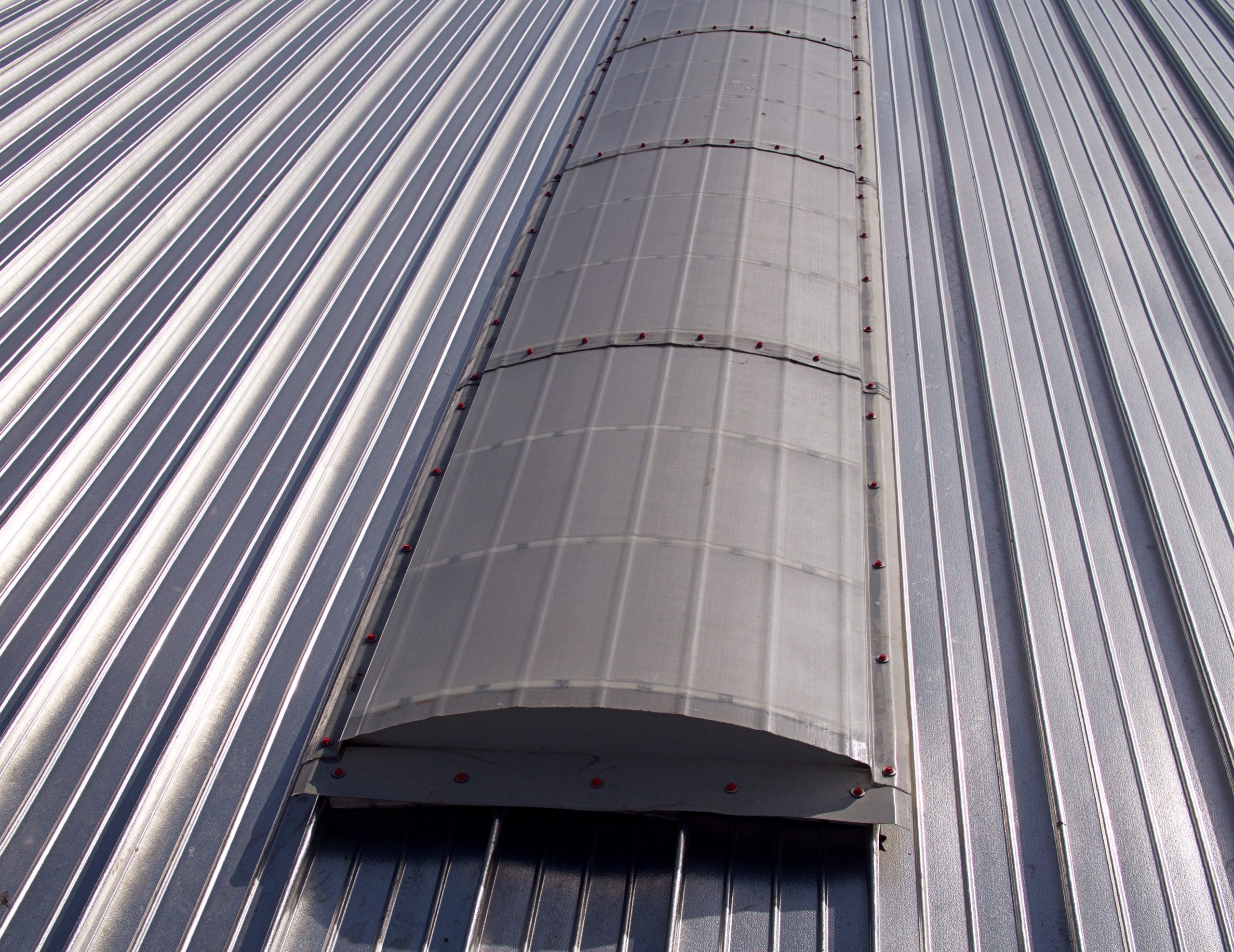 Monarch F on a Standing Seam Roof Continuous barrel vaulted GRP rooflight